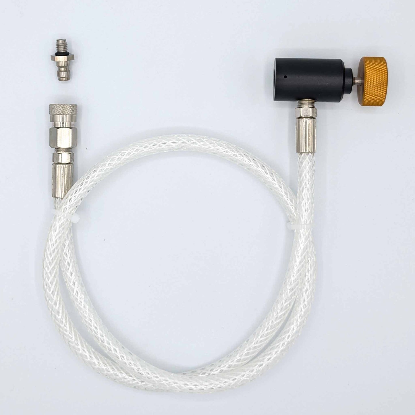Top-down view of Whippiphany N2O regulator with filter adapter disconnected, showing all components separately.