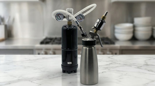 Whippiphany Deluxe 2.0 N2O regulator and filter connected to a whipped cream dispenser on a marble kitchen counter